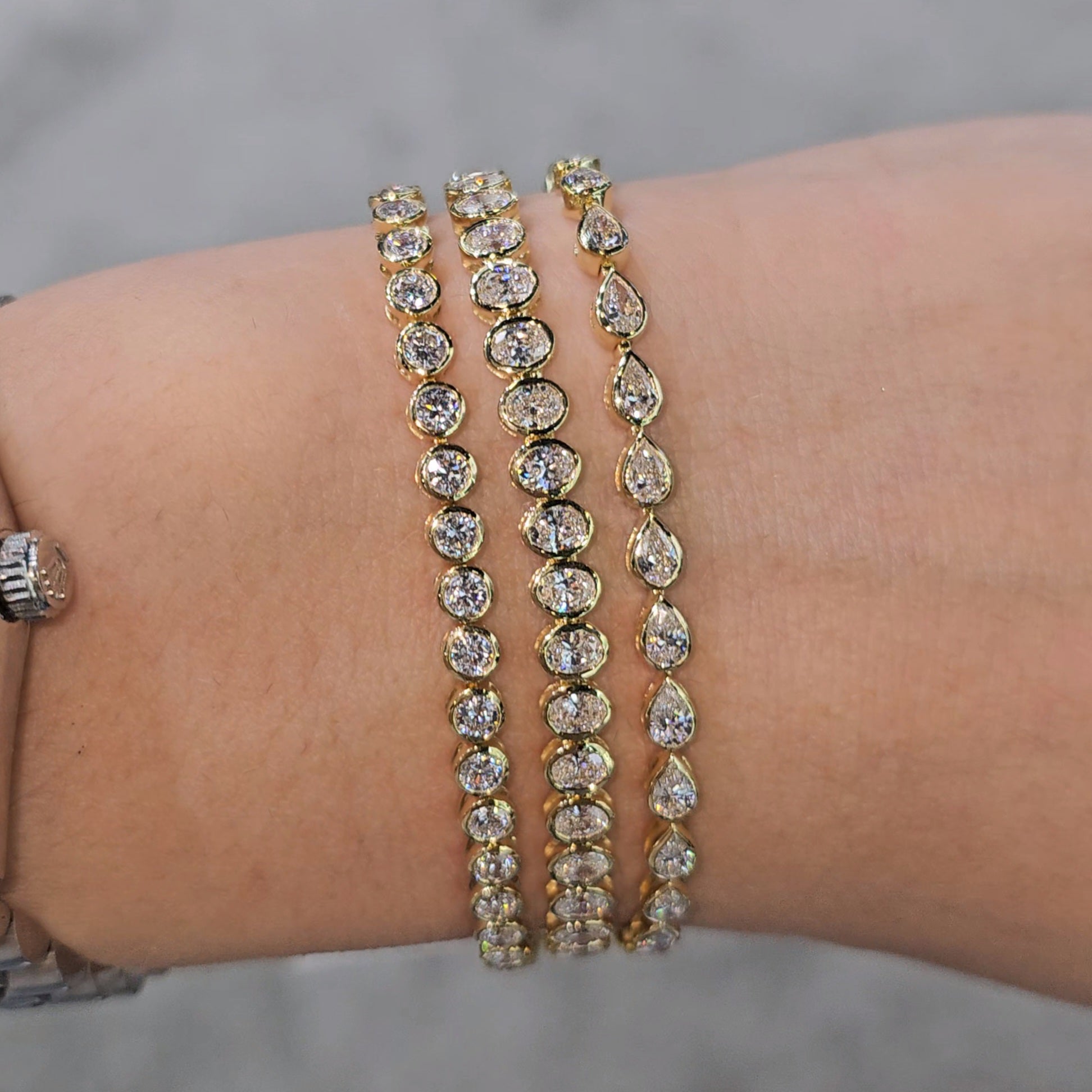 6.00ct Oval cut Lab Grown Diamond Bezel Set Tennis Bracelet in 14k Gold